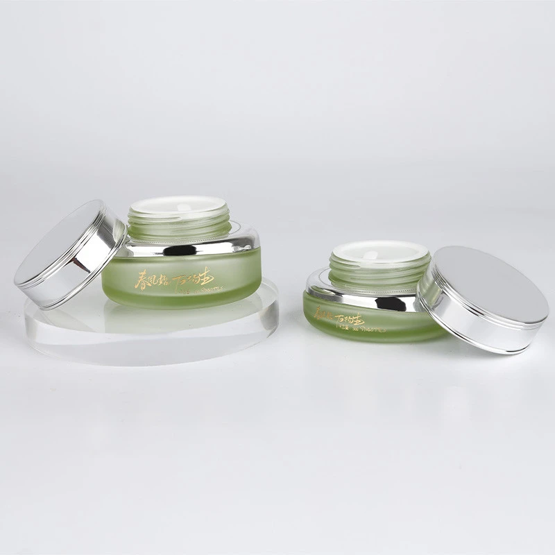 China Cosmetic Bottle Manufacturer With Shoulder Case 30g-50g Cosmetic Jars Wholesale Green Glass Cream Containers Wholesale